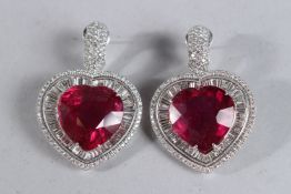 A PAIR OF RUBELITE AND DIAMOND HEART SHAPED EARRINGS, 10ct diamonds and two natural rubelite