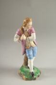 A GOOD HOCHST PORCELAIN FIGURE OF A YOUNG MAN. Circle mark in blue. 17cms high.