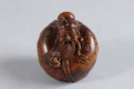 A CARVED WOOD CHINESE MAN NETSUKE. 2.25ins.