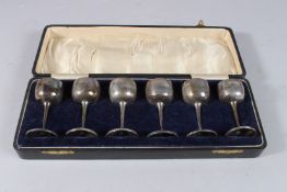 A SET OF SIX MINIATURE SILVER CASED GOBLETS. Birmingham 1947.