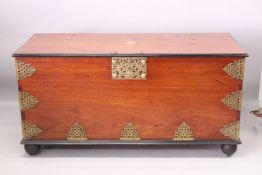 A VERY GOOD, LARGE EASTERN TEAK AND BRASS BOUND COFFER OR MARRIAGE CHEST, with a rising top,
