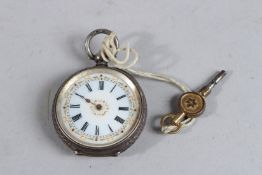 A SILVER POCKET WATCH with key.