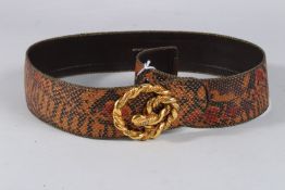 AN EMMANUEL UNGARO SNAKE SKIN BAG.