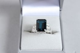 A SILVER ART DECO DESIGN LONDON BLUE TOPAZ RING.