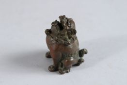 A JAPANESE BRONZE FOO DOG CENSR. 2.5ins.