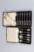 A SET OF SIX CASED SILVER TOP FORKS and six teaspoons and a pair of crest spoons.