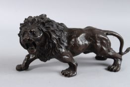 A BRONZE LION. 12.5ins long.