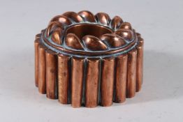 A GOOD COPPER JELLY MOULD BY ROBINET A. METZ. 6ins diameter.