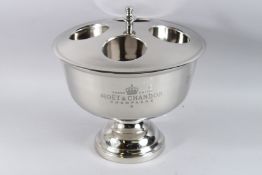 A MOET & CHANDON FOUR BOTTLE CHAMPAGNE COOLER. 12ins high.