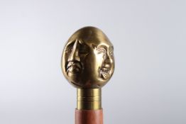 A THREE HEAD HANDLE WALKING STICK. 36ins long.