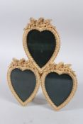 A GILT BRONZE TRIPLE HEART SHAPED FRAME.