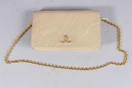 A TAN ED REILLY, PARIS LEATHER BAG.