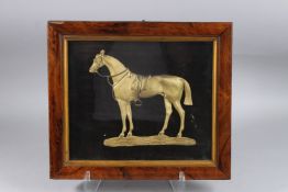 A FRAMED AND GLAZED GILT MODEL OF A HORSE. 12ins x 15ins.