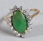 AN 18CT GOLD, JADE AND DIAMOND RING.