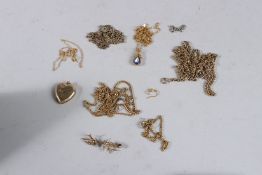 A 9CT GOLD LOCKET, a 9ct gold bar brooch and miscellaneous chains.