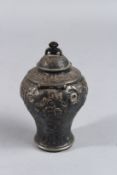 A GEORGE III CANISTER AND COVER with repousse decoration. London 1755.