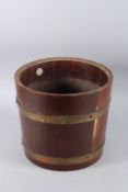A WOODEN CIRCULAR BRASS BOUND BUCKET. 11ins high.