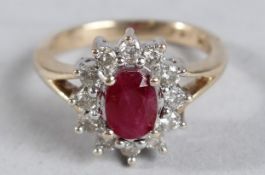 A RUBY AND DIAMOND CLUSTER RING.