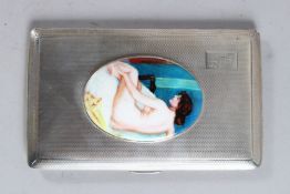 A GEORGE VI ENGINE TURNED SILVER CIGARETTE CASE. 5.5ins x 3.25ins. Birmingham 1945, with an oval