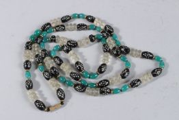 A JADE AND CRYSTAL NECKLACE. 38ins long.