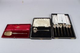 A CHILD'S CAST SILVER PUSHER AND SPOON, Birmingham 1943, a silver gilt cased anointing spoon and six