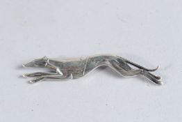A SILVER GREYHOUND BROOCH.