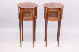 A PAIR OF LOUIS XVITH STYLE ROUND TOP THREE DRAWER BEDSIDE TABLES on slender legs. 12ins diameter