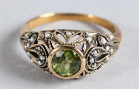 A 9CT GOLD PERIDOT AND PEARL RING.