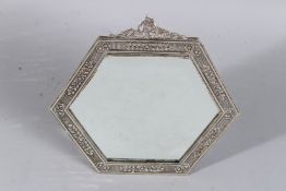 AN OCTAGONAL SILVER MIRROR. 7ins x 7ins.