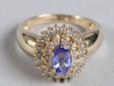 A TANZANITE AND DIAMOND RING 14ct.