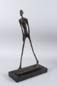 AFTER A. GIACOMETTI (1901 - 1966) SWISS. A BRONZE STICK MAN on a marble base. 17.5ins high.
