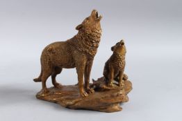GROUP OF TWO BRONZE WOLVES. 9ins high.