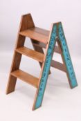 A PAIR OF CHAMPAGNE FOLDING WOOD LADDERS. 5ft x 1ft 4ins.