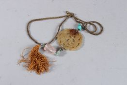 AN ISLAMIC JADE NECKLACE AND PENDANT.