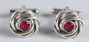 SILVER AND RUBY KNOT CUFFLINKS.