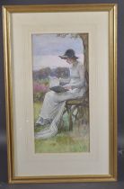 LATE 19TH / EARLY 20TH CENTURY Seated woman reading beneath a tree, watercolour, initialled GST 50cm
