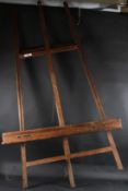 AN ARTISTS WOODEN EASEL height 187cm width 117cm