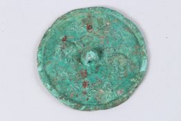 A BRONZE ARCHAIC CIRCULAR MIRROR. 3ins.