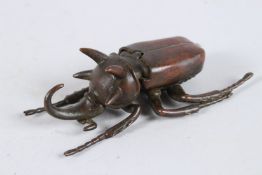 A JAPANESE BRONZE BEETLE with articulated body. 4ins long.