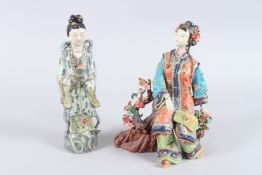 A CHINESE PORCELAIN FIGURE OF A WOMAN SEATED ON A BRANCH, with birds by her side, together with a