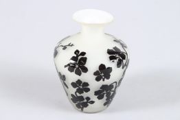 A SMALL CHINESE PEKING GLASS VASE, decorated with flowers. 10cms high.