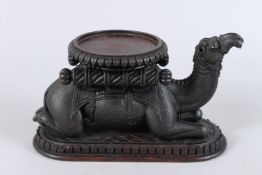 A VERY FINELY CARVED 19TH CENTURY INDIAN WOODEN CAMEL STAND. 10ins long.