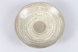 A KOREAN POTTERY CIRCULAR SHALLOW BOWL. 9ins diameter.