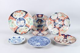 A COLLECTION OF FIVE JAPANESE IMARI PLATES AND DISHES, together with two Japanese porcelain blue and