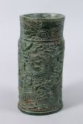 A GOOD LARGE CARVED GREEN JADE VASE carved with dragons. 10ins high.