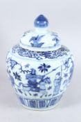 A CHINESE BLUE AND WHITE GINGER JAR AND COVER. 12ins high.