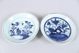 TWO 19TH CENTURY CHINESE BLUE AND WHITE PORCELAIN DISHES, each painted with flowering shrubs.