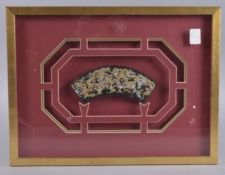 A CHINESE GILDED BLACK LACQUER PANEL, framed and glazed, panel 18cms wide.