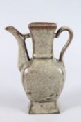 A CHINESE CRACKLE GLAZE EARTHENWARE EWER. 24cms high.