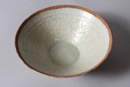 A CHINESE HUTIAN POTTERY BOWL, pale celadon ground with moulded decoration. 19cms diameter.